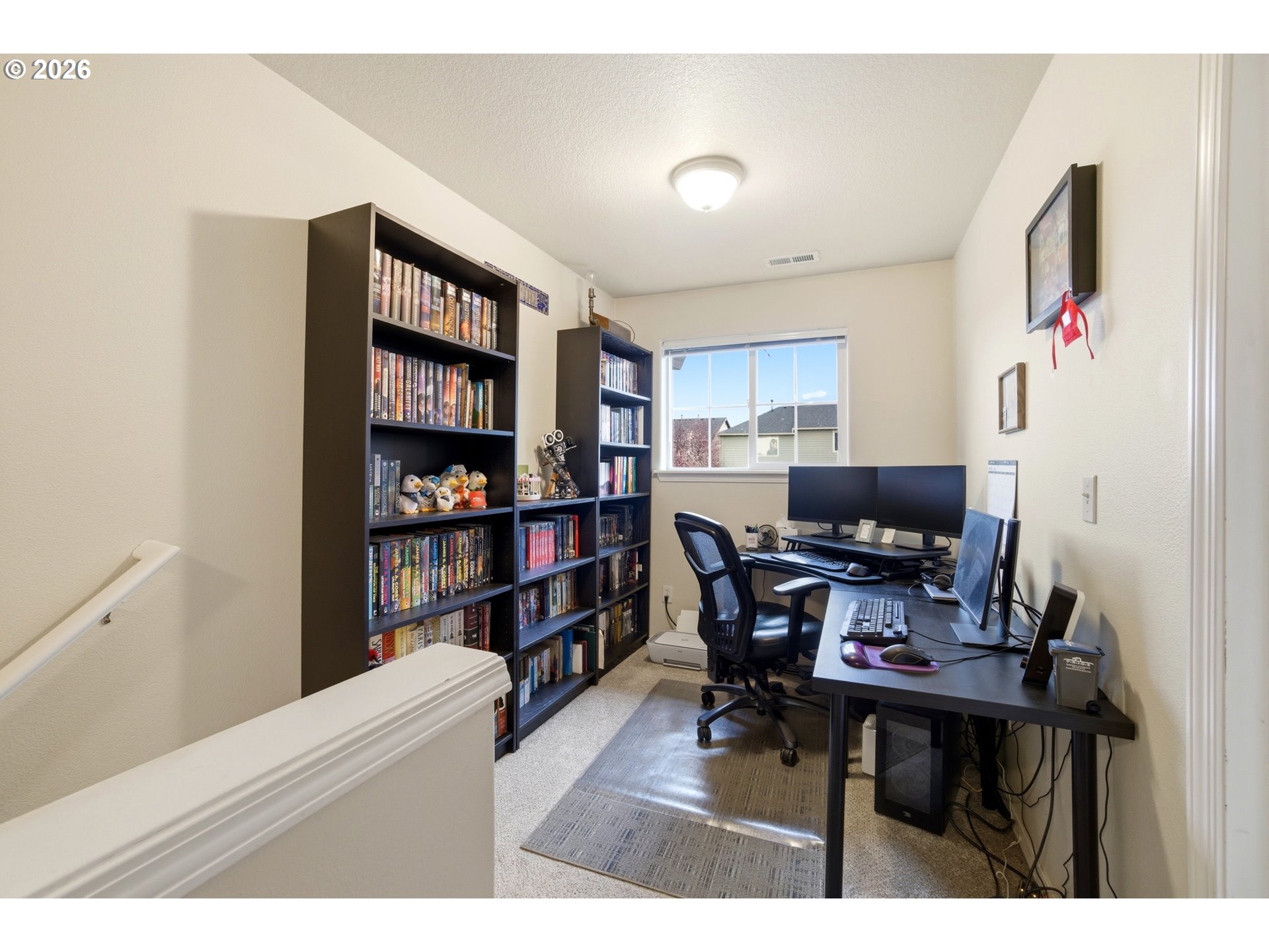 7159 Southwest Millennium Terrace Beaverton, OR 97007 - Photo 12 of 24 a workspace with furniture and a bookshelf