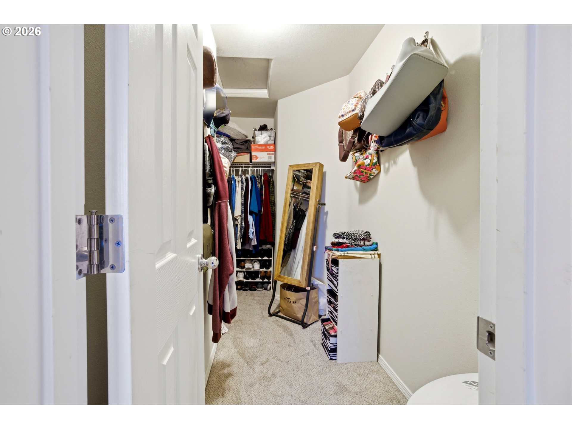 7159 Southwest Millennium Terrace Beaverton, OR 97007 - Photo 15 of 24 a view of walk in closet with clothes and shoes