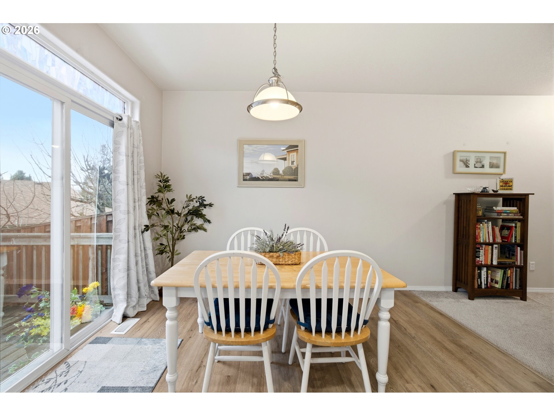 7159 Southwest Millennium Terrace Beaverton, OR 97007 - Photo 10 of 24 a view of a dining room with furniture wooden floor and front door