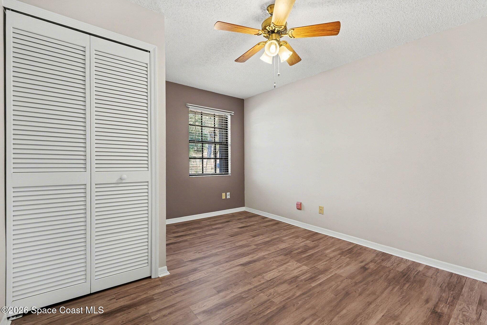 2653 Elliot Way, Unit 6 Melbourne, FL 32935 - Photo 17 of 30 an empty room with windows and fan