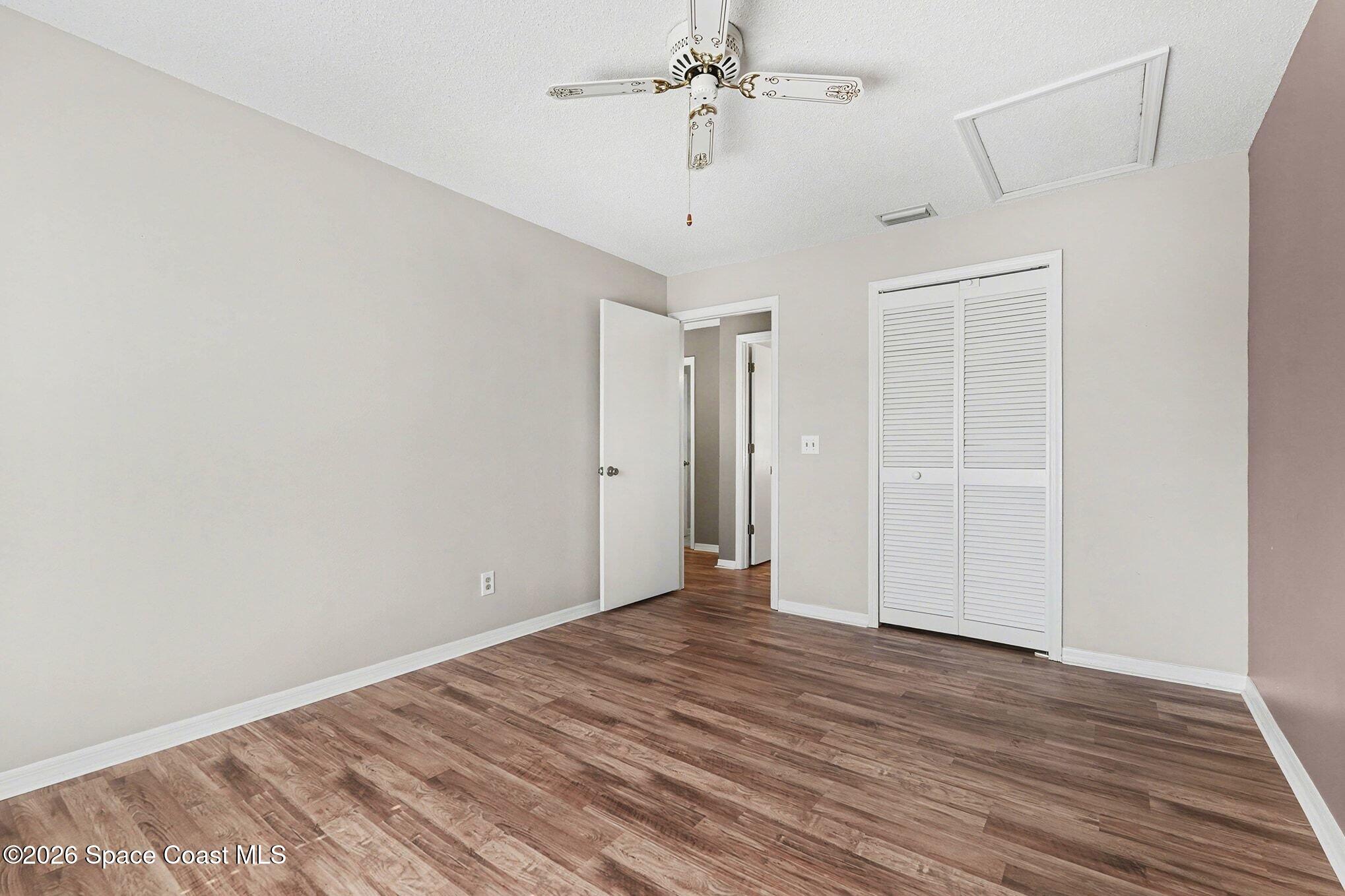 2653 Elliot Way, Unit 6 Melbourne, FL 32935 - Photo 27 of 30 wooden floor in an empty room