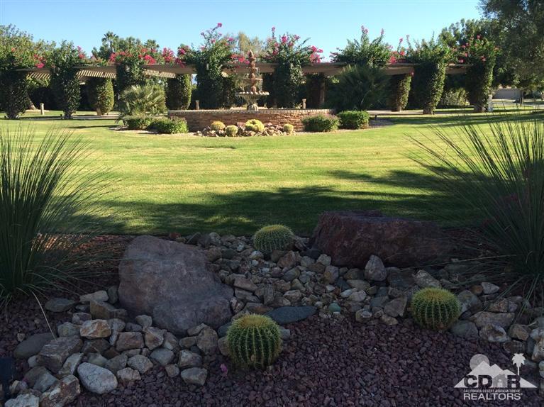 79385 Horizon Palms Circle La Quinta, CA 92253 - Photo 1 of 13 a swimming pool with trees in the background