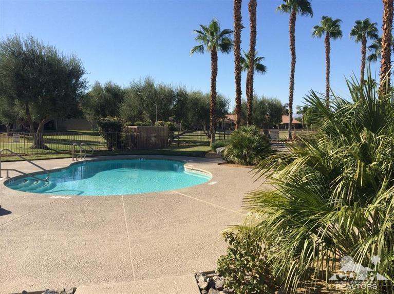 79385 Horizon Palms Circle La Quinta, CA 92253 - Photo 11 of 13 a view of a swimming pool with a yard