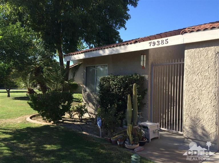 79385 Horizon Palms Circle La Quinta, CA 92253 - Photo 3 of 13 a front view of a house with garden