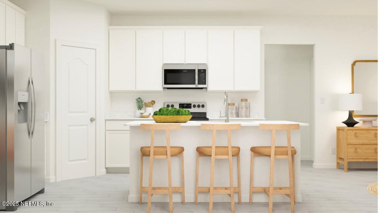 88 Round Robin Run St. Johns, FL 32259 - Photo 23 of 33 a white kitchen with a sink and cabinets