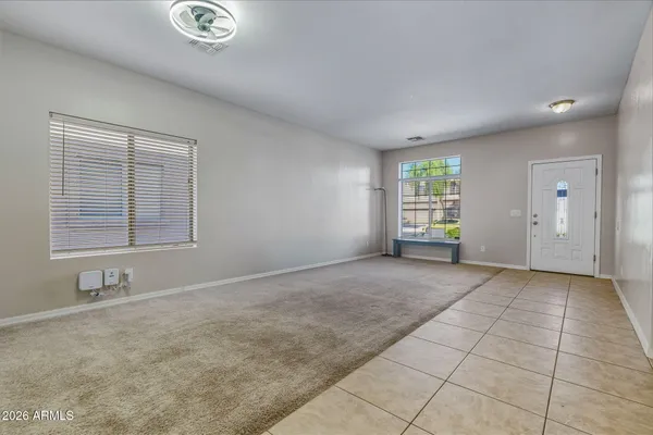 a view of an empty room with a window