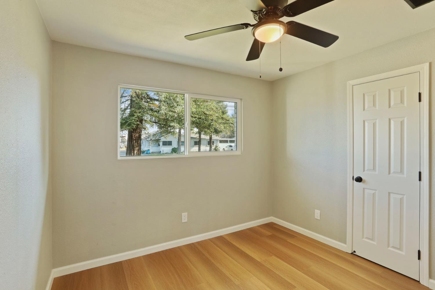 401 Church Street Modesto, CA 95357 - Photo 18 of 28 a view of an empty room with a window