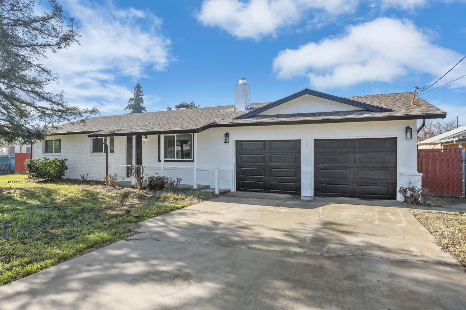 401 Church Street Modesto, CA 95357 - Photo 2 of 28 a front view of a house with a yard