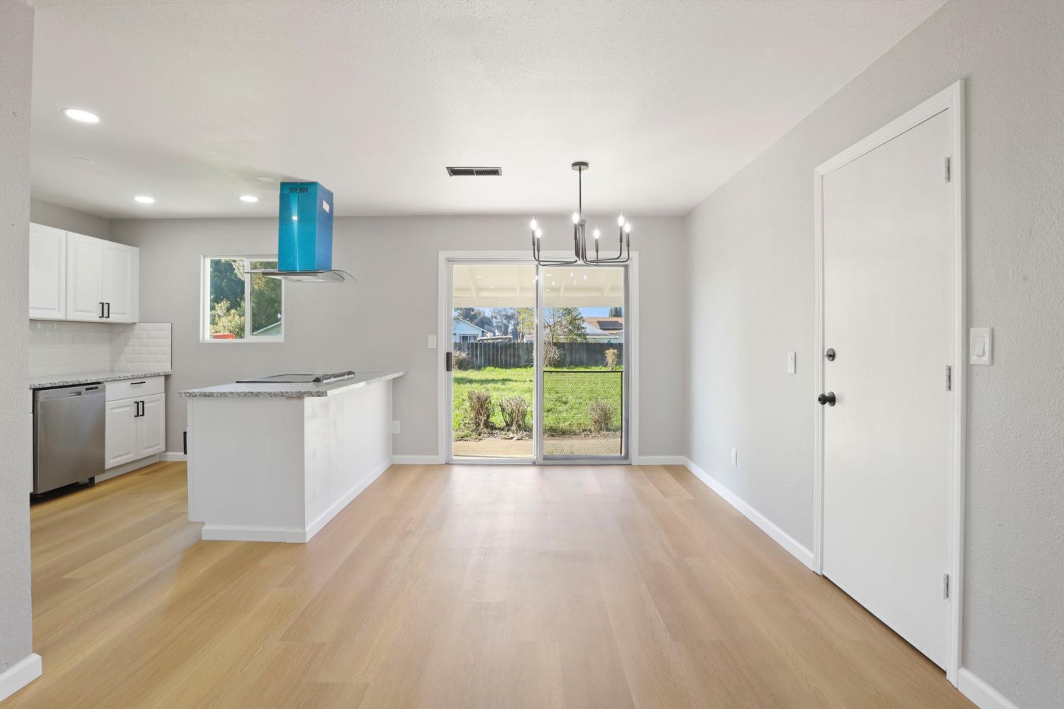 401 Church Street Modesto, CA 95357 - Photo 6 of 28 a view of a kitchen with wooden floor and electronic appliances