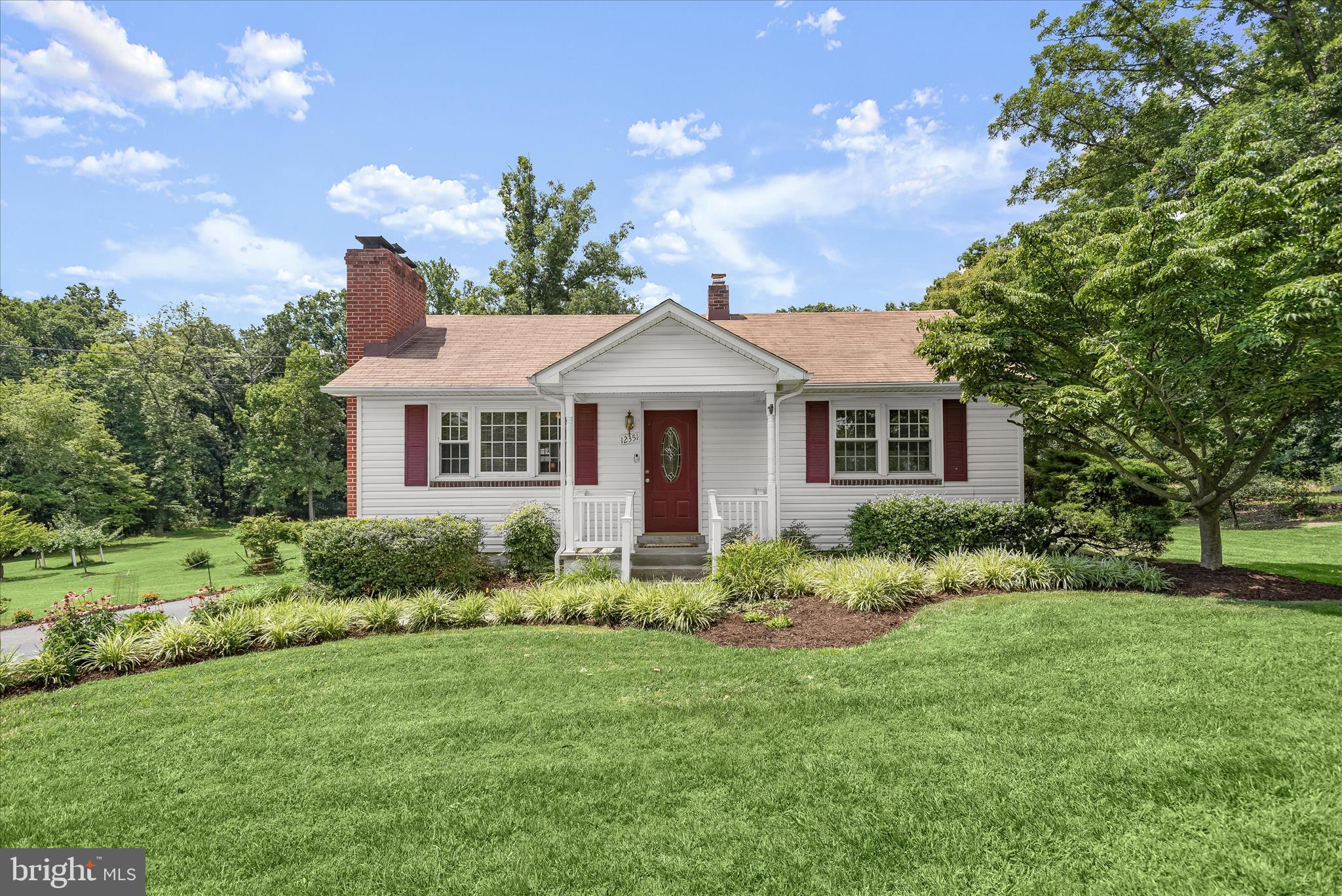 12351 Scaggsville Road Highland, MD 20777 - Photo 1 of 43 a front view of a house with a yard