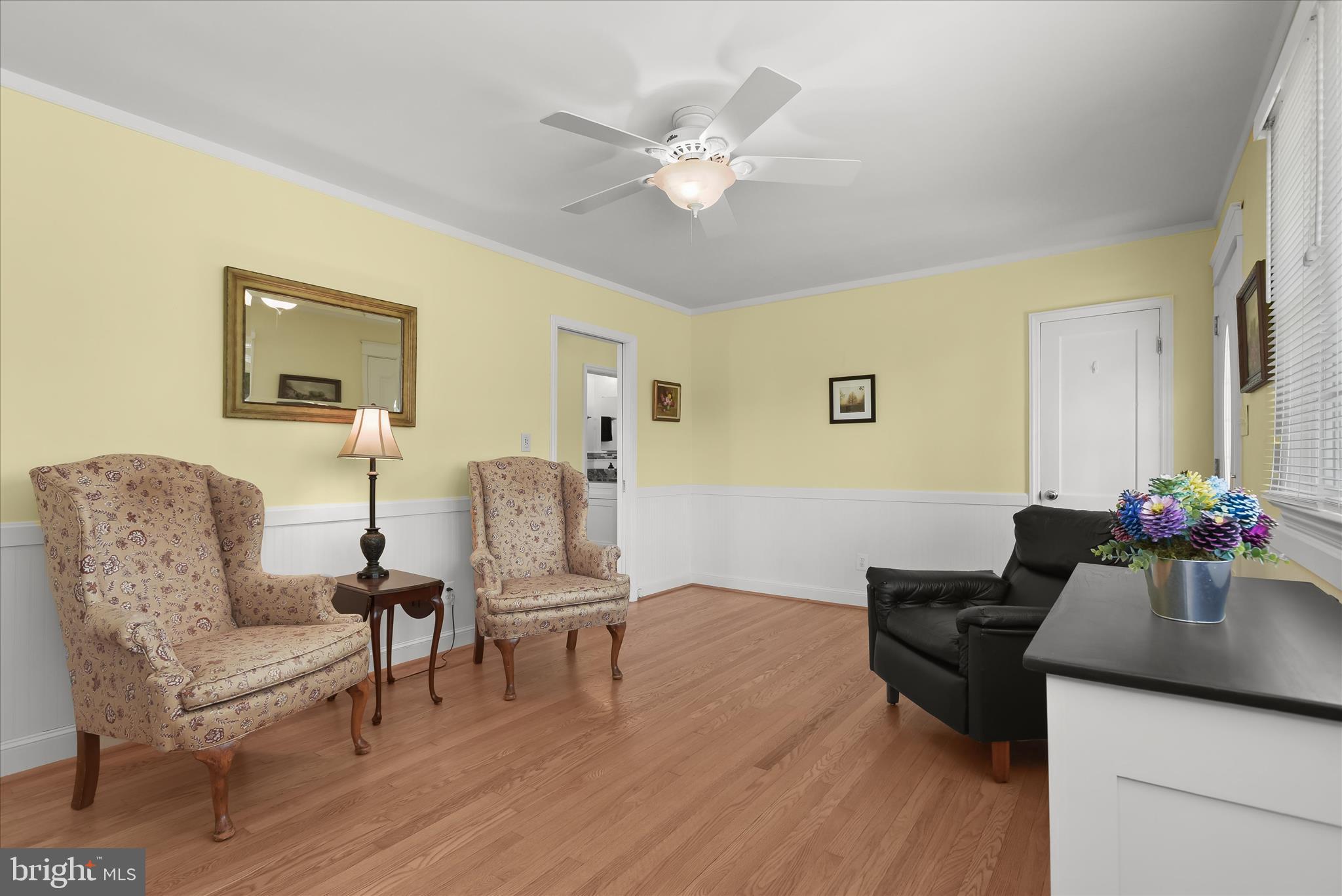 12351 Scaggsville Road Highland, MD 20777 - Photo 12 of 43 a living room with furniture and a chandelier