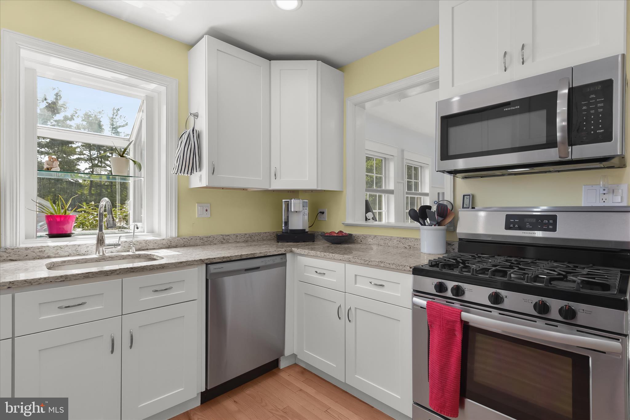 12351 Scaggsville Road Highland, MD 20777 - Photo 13 of 43 a kitchen with stainless steel appliances granite countertop white cabinets a sink and a stove