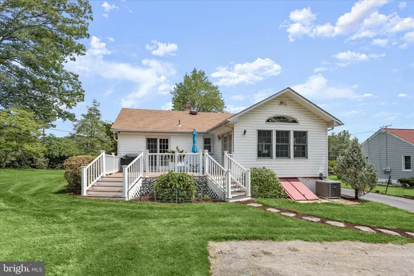a view of outdoor space with deck and yard