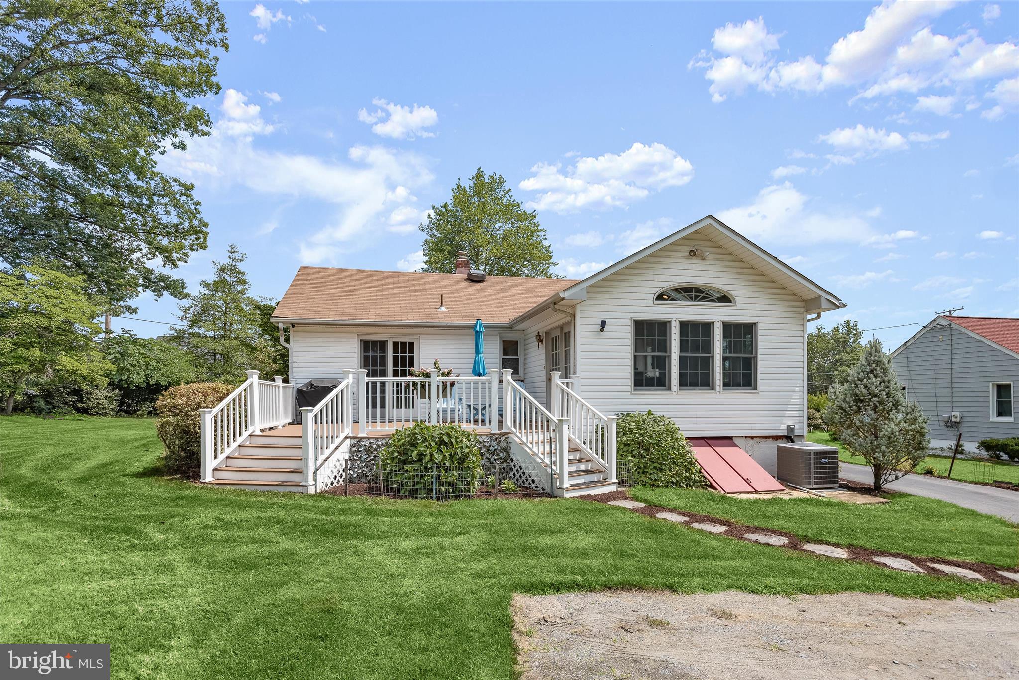 12351 Scaggsville Road Highland, MD 20777 - Photo 30 of 43 a front view of a house with a garden