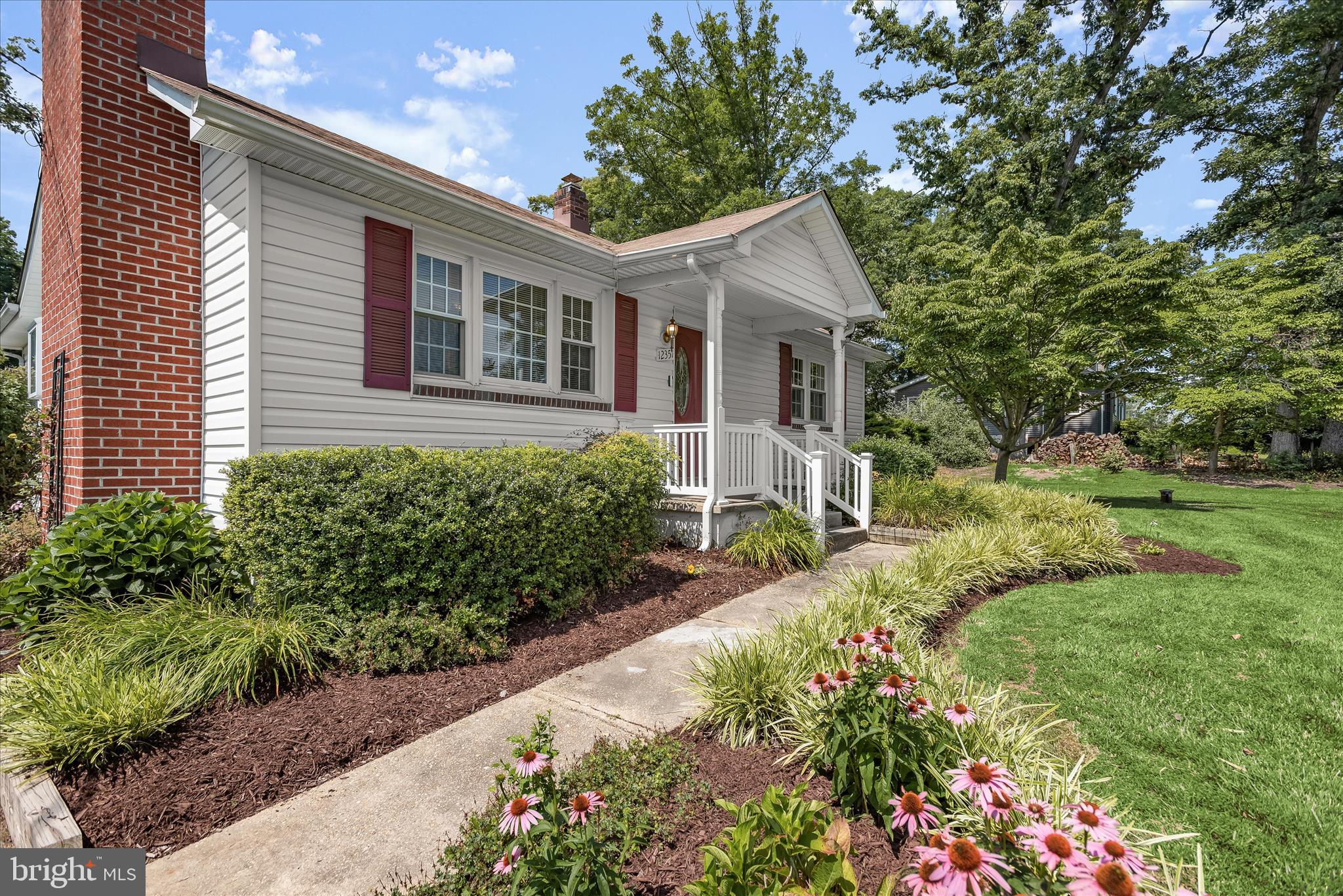 12351 Scaggsville Road Highland, MD 20777 - Photo 8 of 43 a view of a house with a yard and potted plants