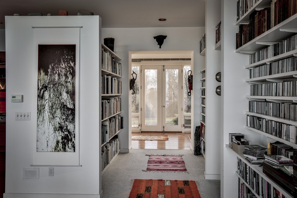 1 Folly Point Road Gloucester, MA 01930 - Photo 12 of 30 a living room with furniture and a book shelf