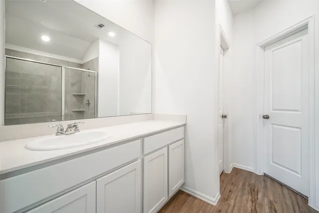 a bathroom with a sink and a mirror