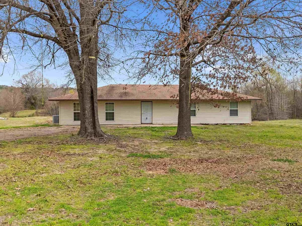 a house with trees in front of it