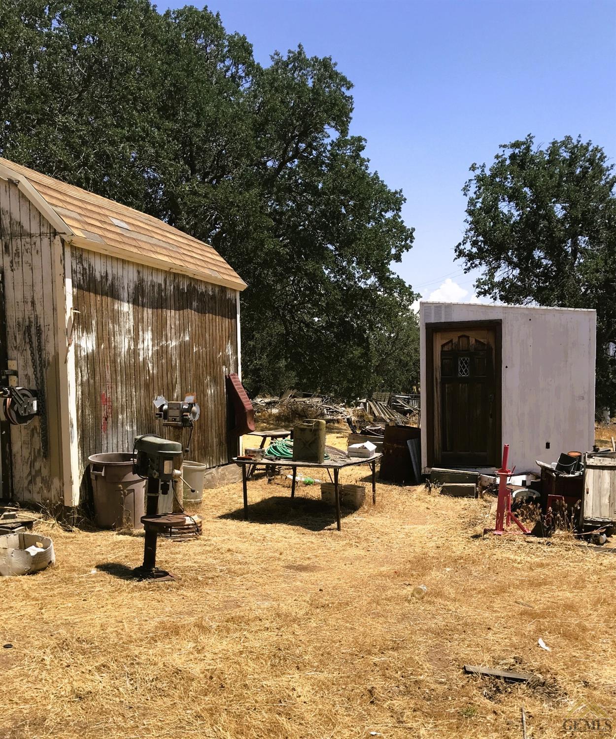 Undisclosed Address Caliente, CA 93518 - Photo 4 of 14 a view of a patio with table and chairs with wooden floor and fence