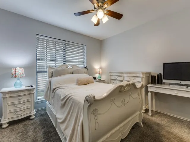 a bedroom with a bed and a tv