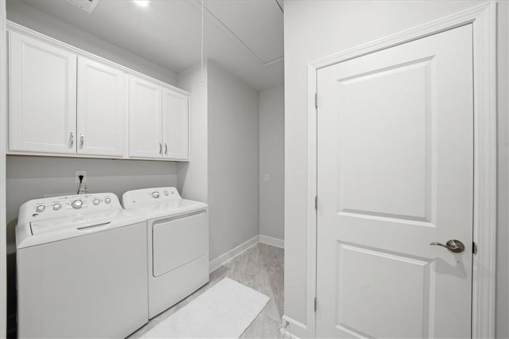 2457 Naples Street Hoschton, GA 30548 - Photo 38 of 41 a utility room with dryer and washer