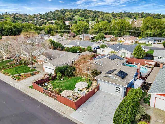 an aerial view of a house with a garden
