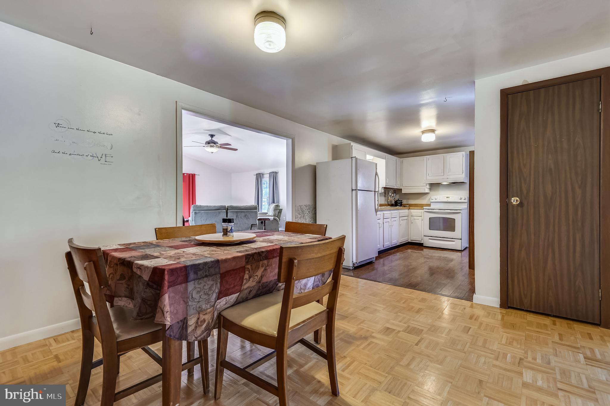 658 New Bridge Road Rising Sun, MD 21911 - Photo 11 of 35 a kitchen with stainless steel appliances kitchen island granite countertop a table chairs sink and cabinets