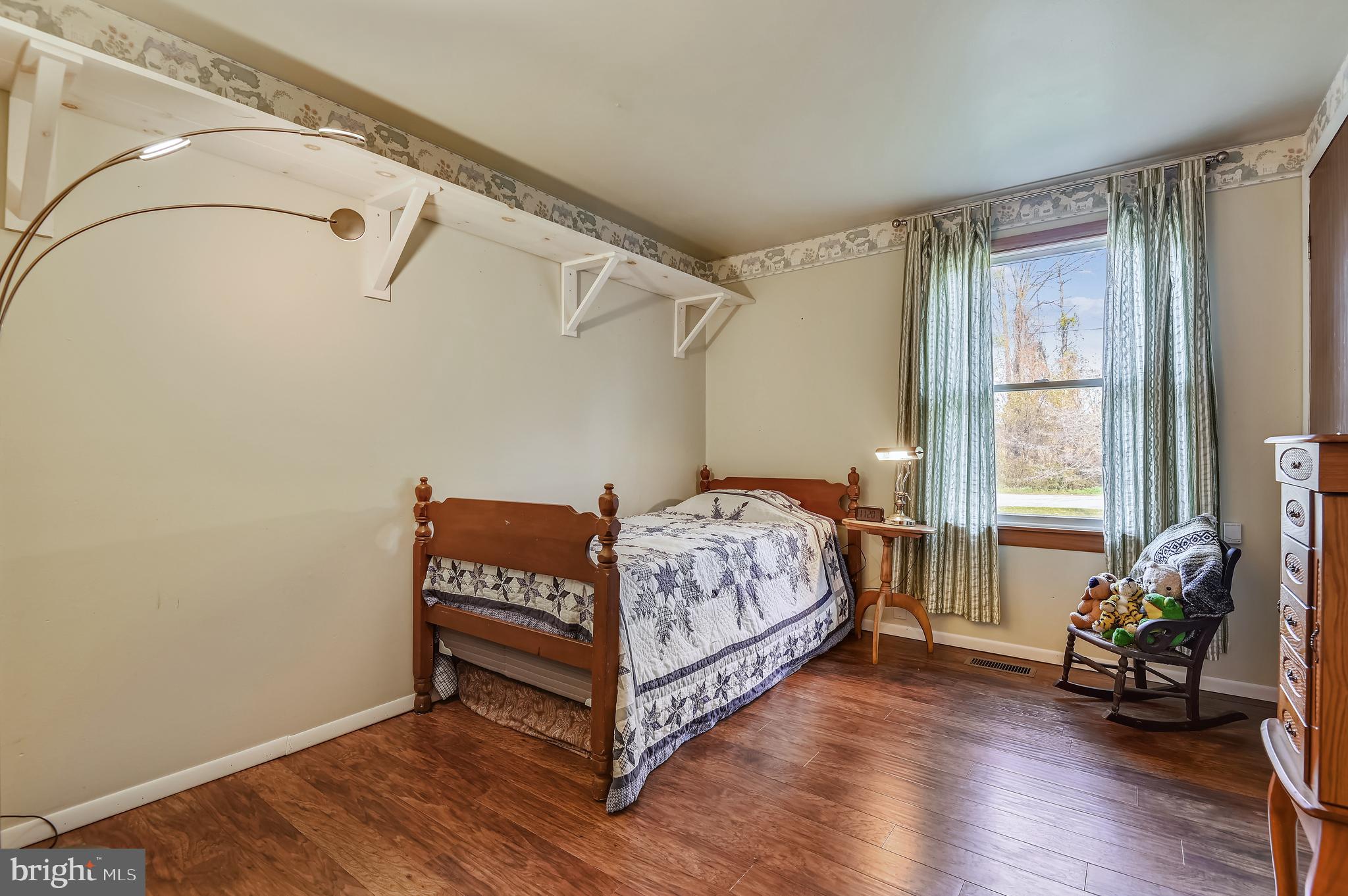 658 New Bridge Road Rising Sun, MD 21911 - Photo 25 of 35 a bedroom with a bed and wooden floor