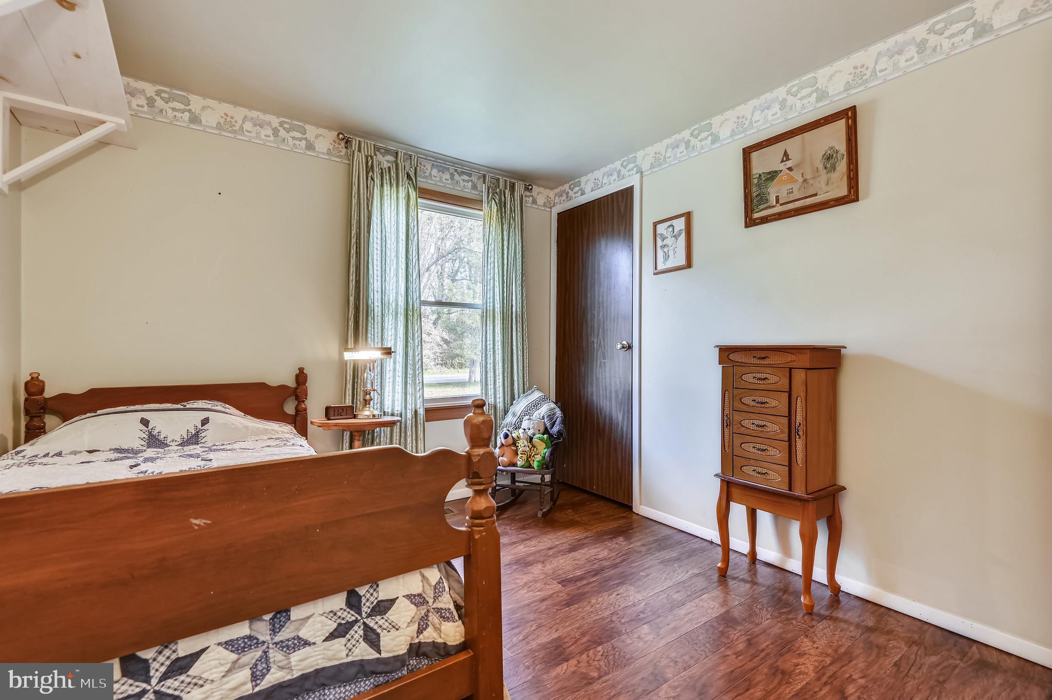 658 New Bridge Road Rising Sun, MD 21911 - Photo 26 of 35 a bed sitting in a bedroom next to a window