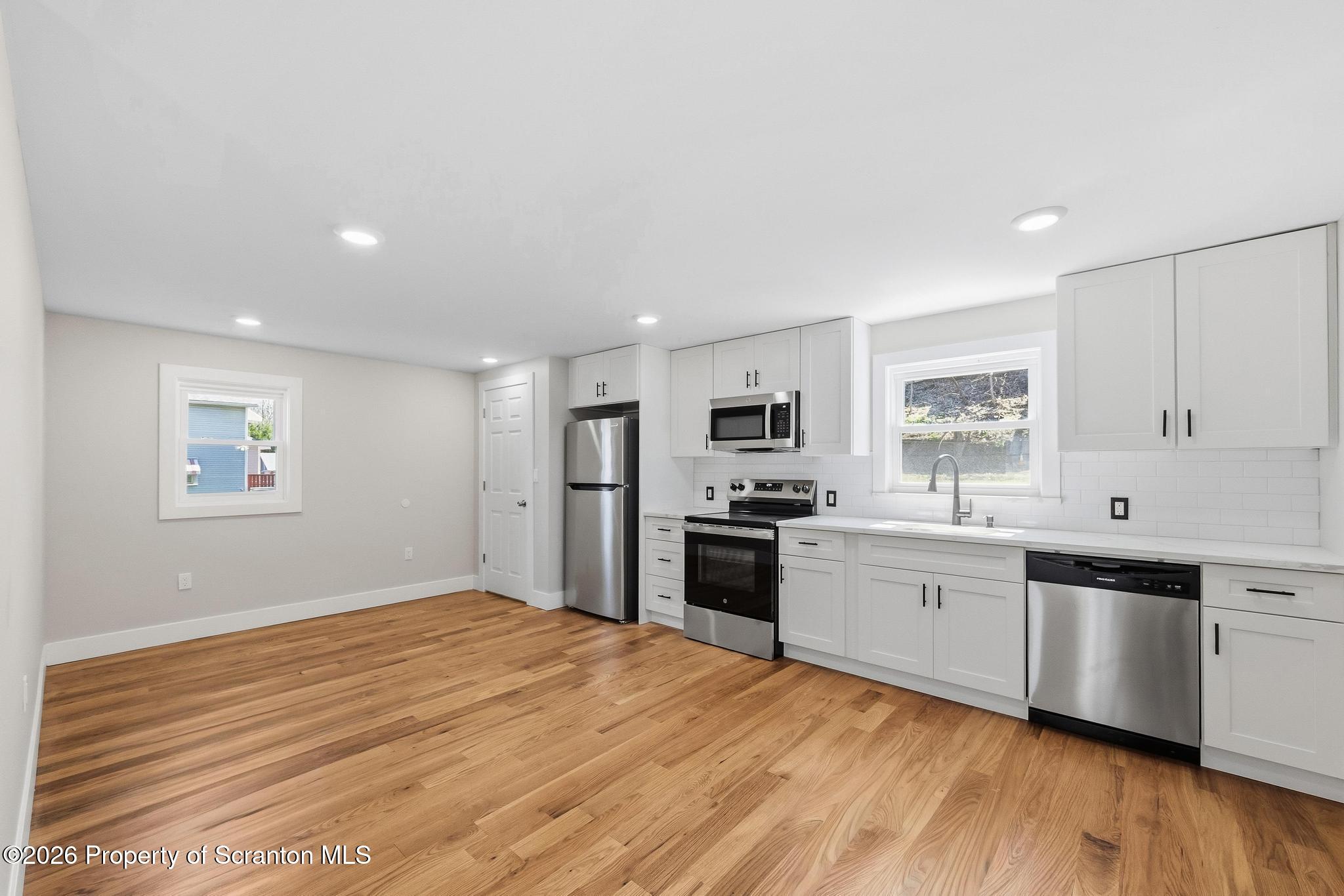 305 Parsonage Street Pittston, PA 18640 - Photo 12 of 42 a large kitchen with cabinets and stainless steel appliances