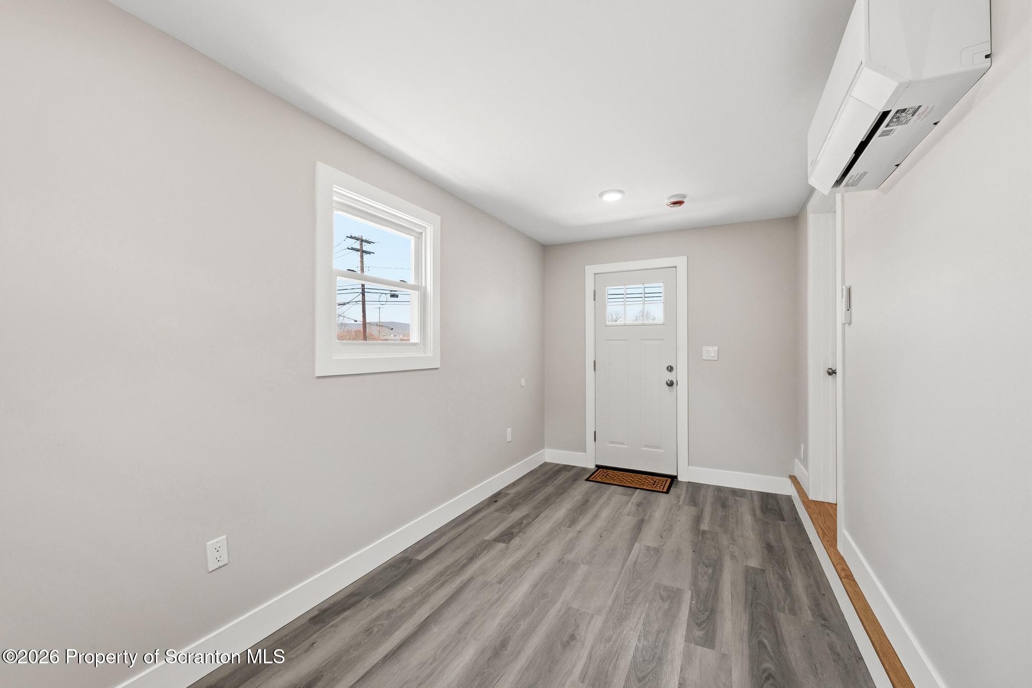 305 Parsonage Street Pittston, PA 18640 - Photo 16 of 42 a view of a room with wooden floor and window