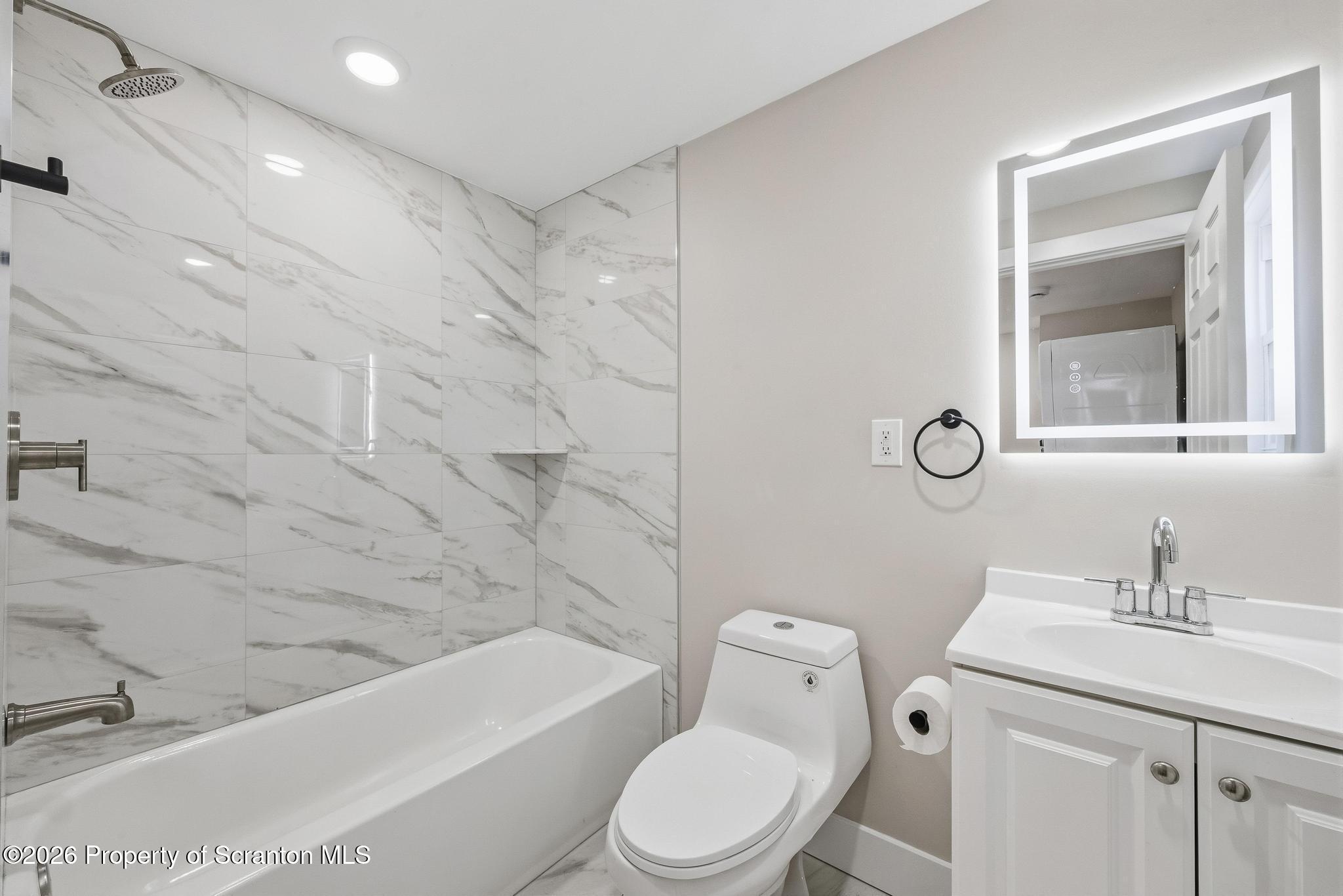 305 Parsonage Street Pittston, PA 18640 - Photo 22 of 42 a bathroom with a sink a toilet and shower