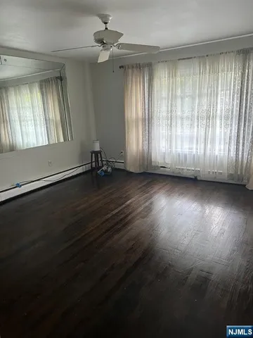 an empty room with wooden floor