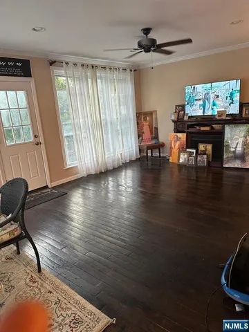 a view of a workspace with furniture window and wooden floor