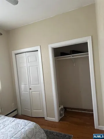 a room with wooden floor and furniture