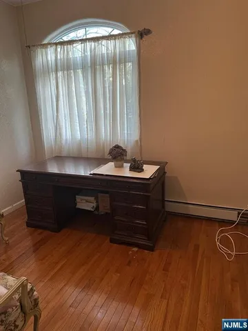 a bathroom with a granite countertop sink mirror and toilet