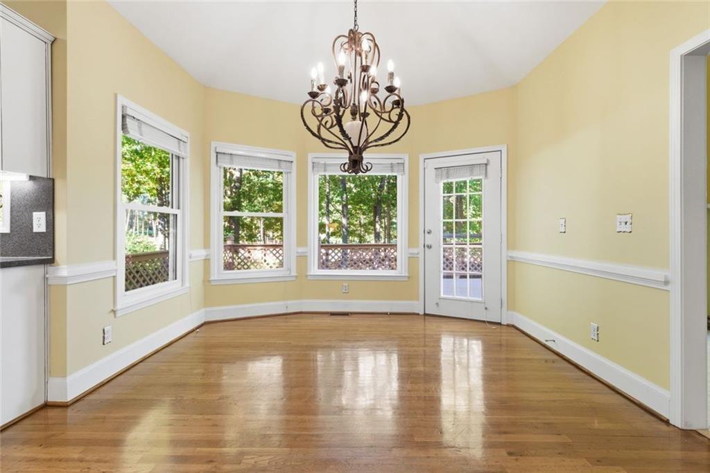 1401 Downington View Acworth, GA 30101 - Photo 16 of 57 a view of empty room with window and wooden floor