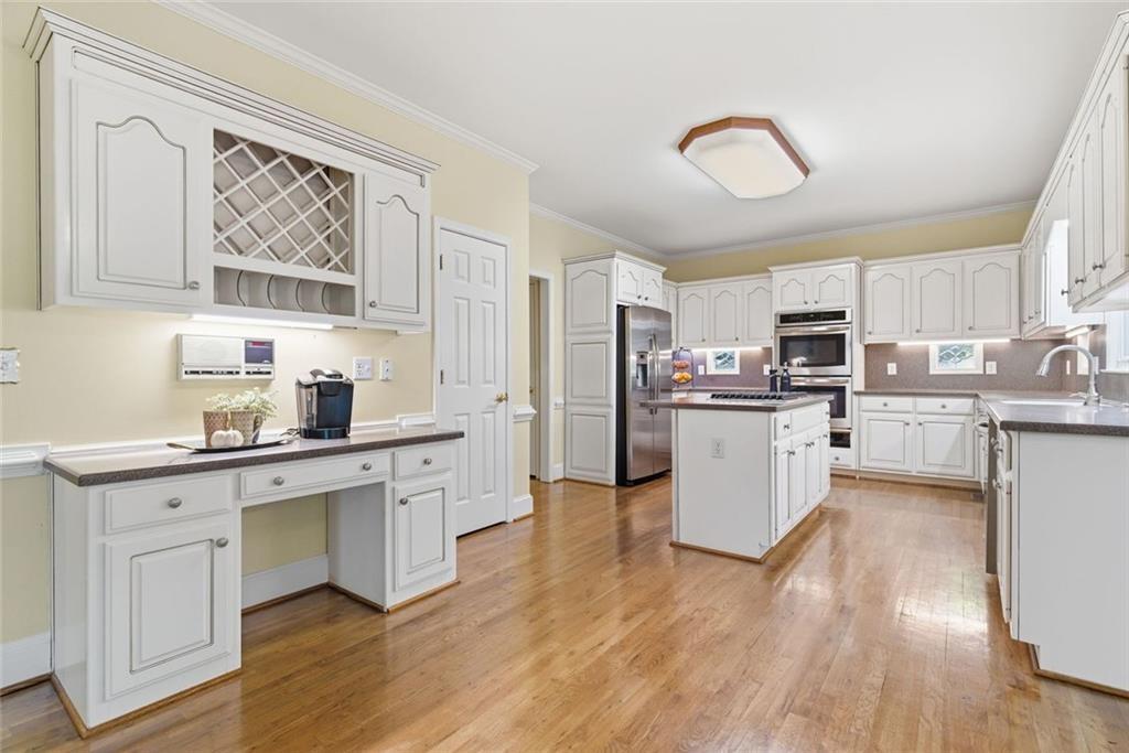 1401 Downington View Acworth, GA 30101 - Photo 17 of 57 a kitchen with white cabinets and white appliances