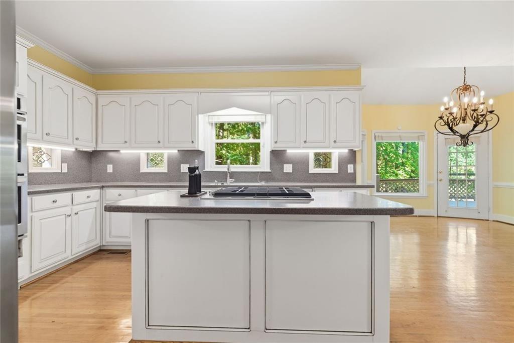 1401 Downington View Acworth, GA 30101 - Photo 18 of 57 a kitchen with stainless steel appliances granite countertop a sink and cabinets