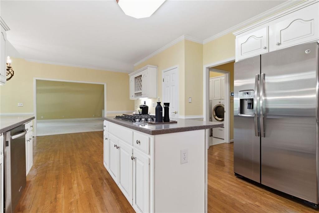 1401 Downington View Acworth, GA 30101 - Photo 19 of 57 a kitchen with stainless steel appliances granite countertop a refrigerator and a sink