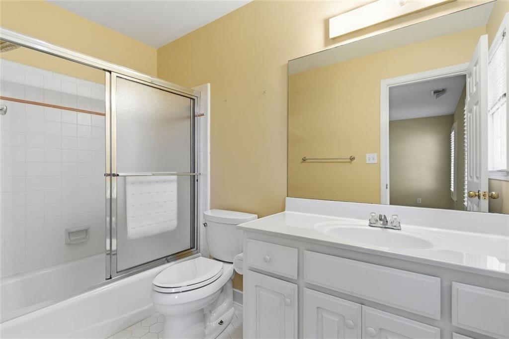 1401 Downington View Acworth, GA 30101 - Photo 28 of 57 a bathroom with a granite countertop sink toilet and shower