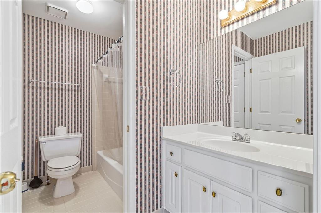 1401 Downington View Acworth, GA 30101 - Photo 33 of 57 a bathroom with a sink a toilet and shower