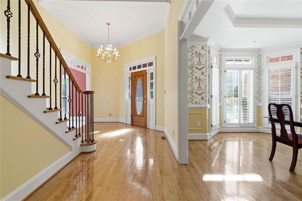 1401 Downington View Acworth, GA 30101 - Photo 9 of 57 a view of a hallway with wooden floor and stairs