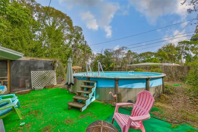a view of a chair and table in the garden