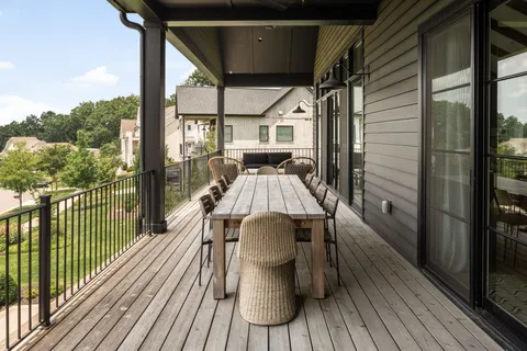 a view of balcony with furniture
