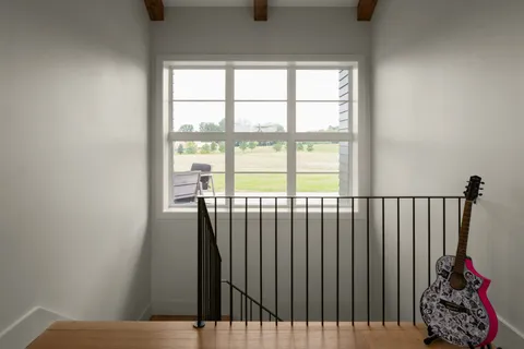 a view of a balcony with wooden floor