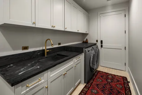 a bedroom with a large bed and a large window