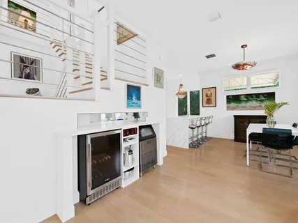 a kitchen with stainless steel appliances kitchen island granite countertop a sink and cabinets