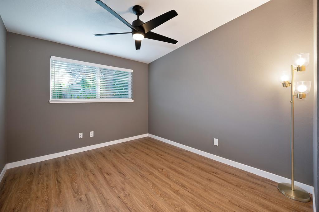 4812 Packard Court Carmichael, CA 95608 - Photo 23 of 39 wooden floor in an empty room with a window