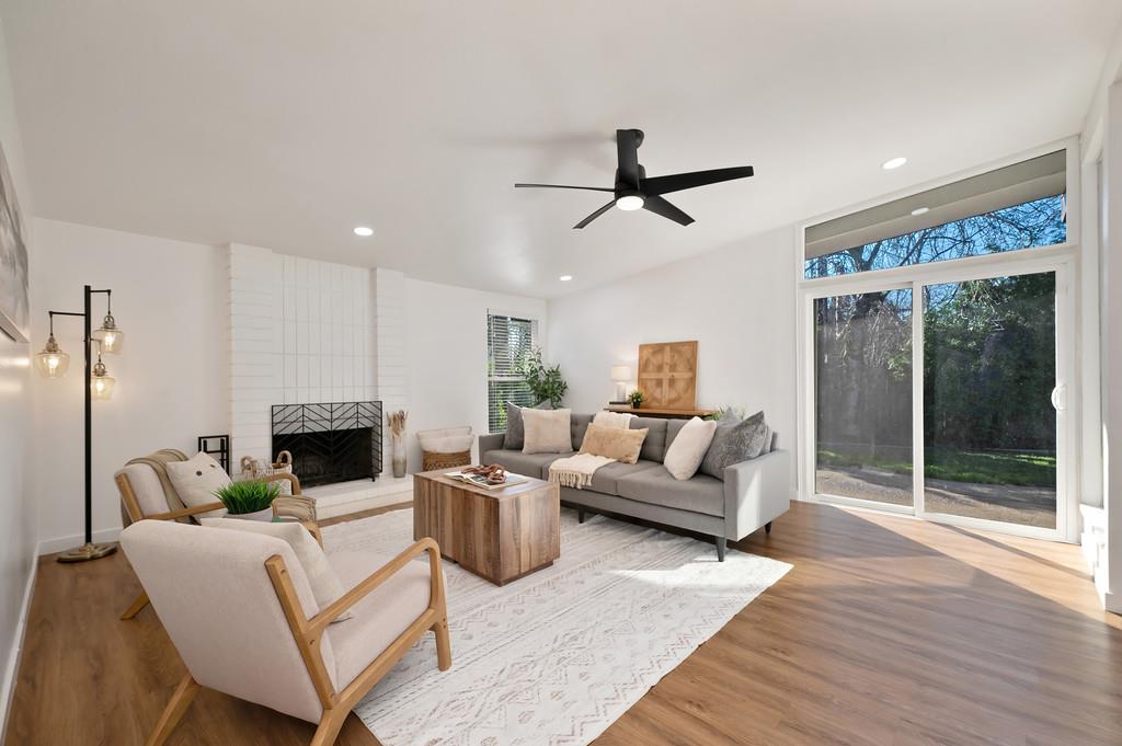 4812 Packard Court Carmichael, CA 95608 - Photo 4 of 39 a living room with furniture a large window and a fireplace
